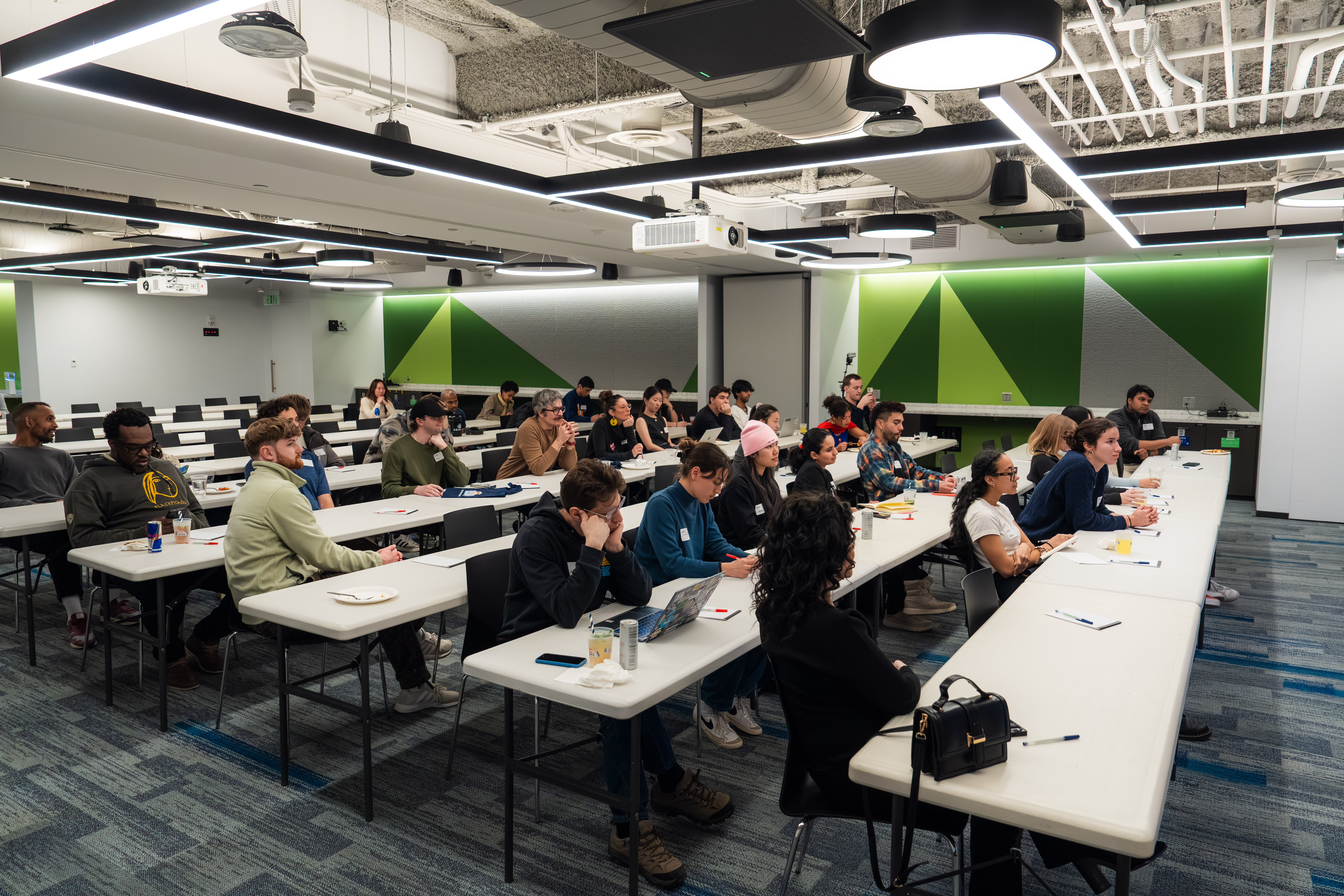 Audience participating in an AI content design workshop